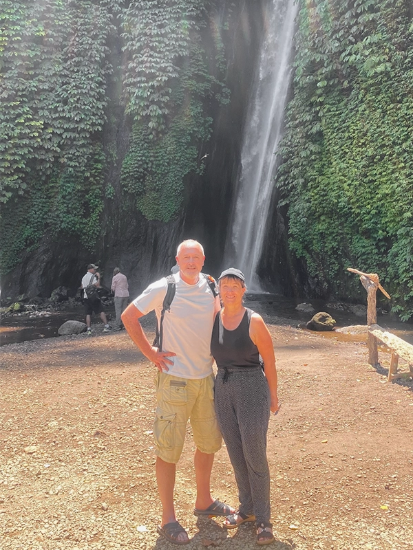 Munduk Waterfall in North Bali surrounded by lush tropical forest